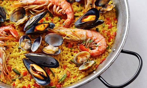 Typical spanish seafood paella in traditional pan